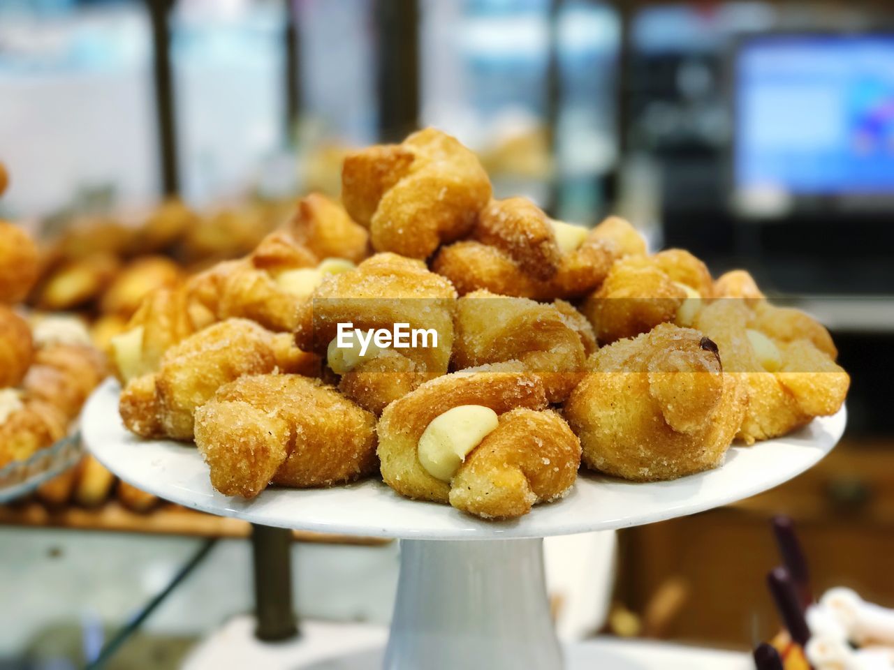 Close-up of desserts on cakestand in store