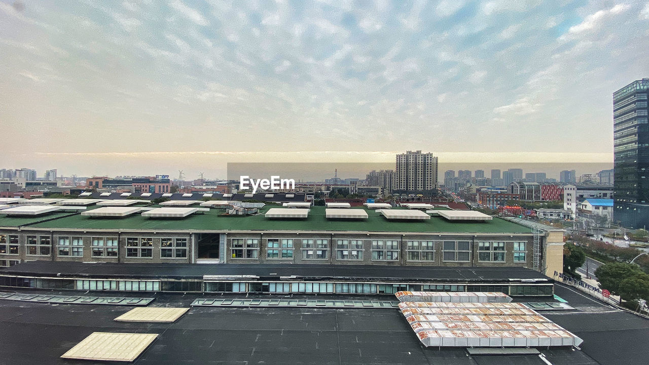 High angle view of buildings against sky during sunset