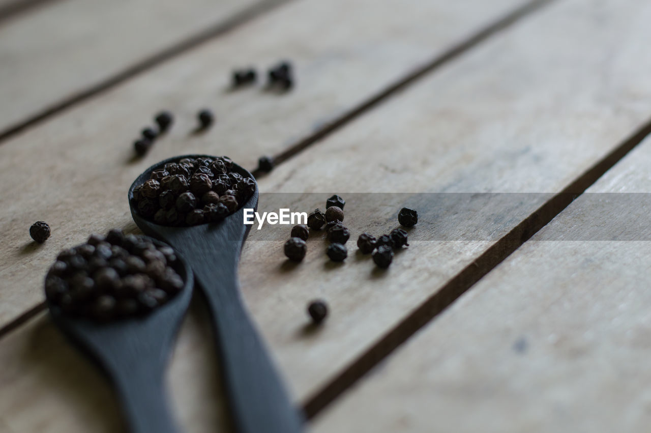 High angle view of black peppercorn on table