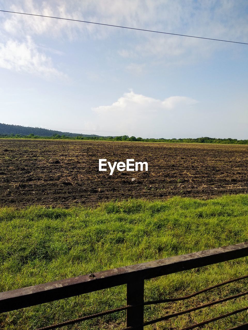 Scenic view of land against sky