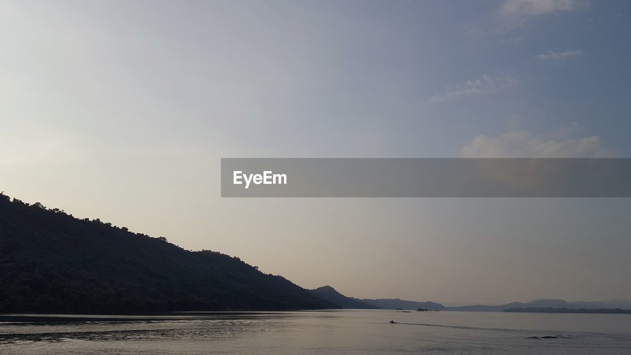 SCENIC VIEW OF SEA AND MOUNTAINS