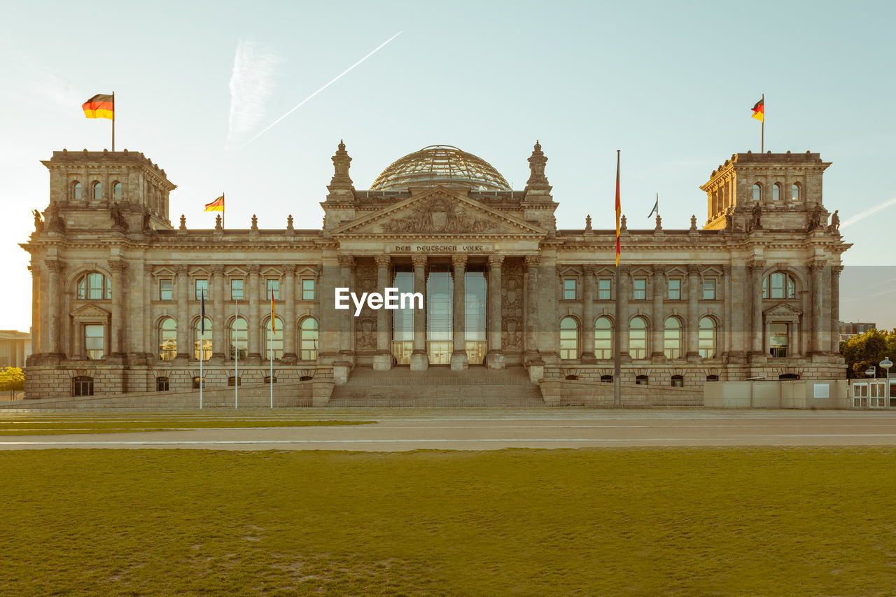The reichstag against sky during sunset