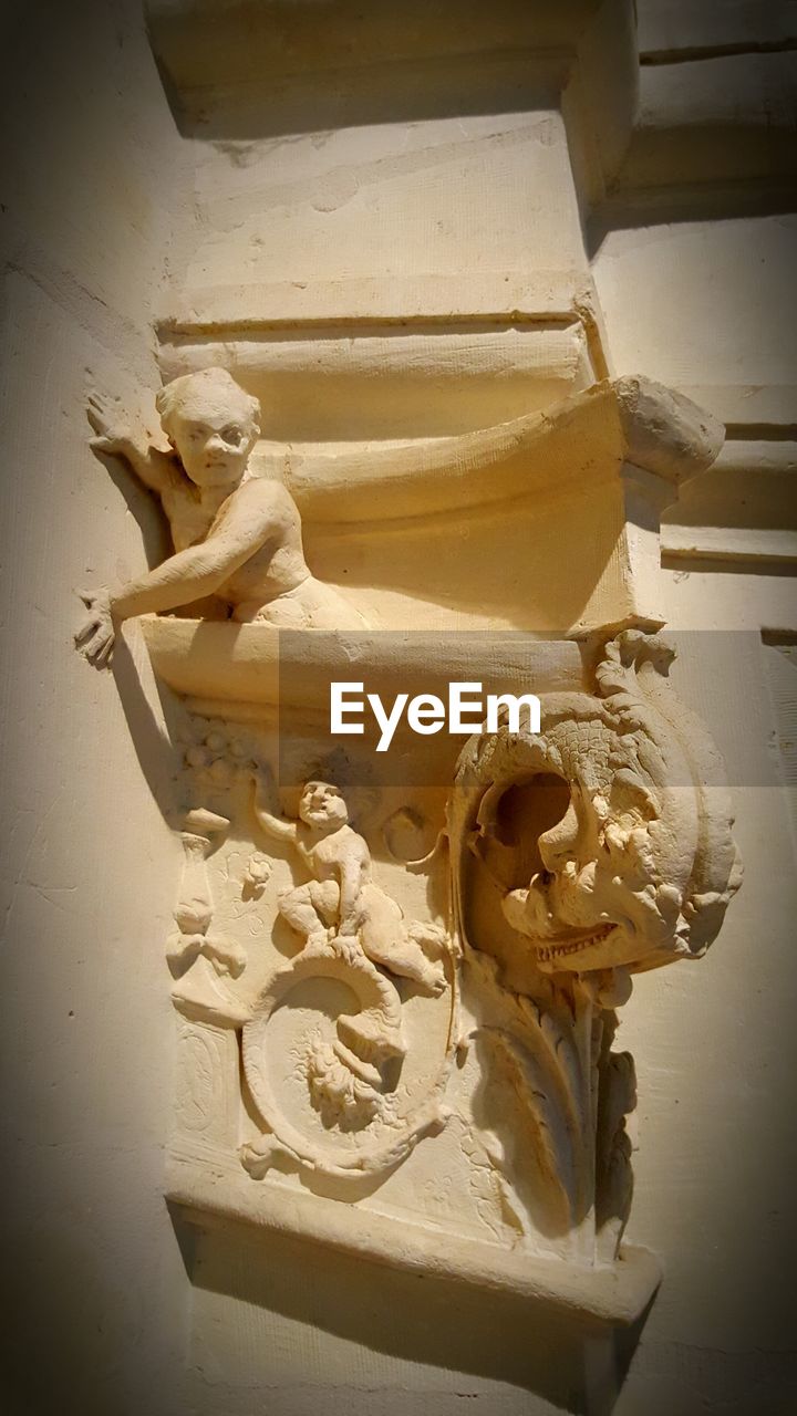 Low angle view of gargoyle on building faade