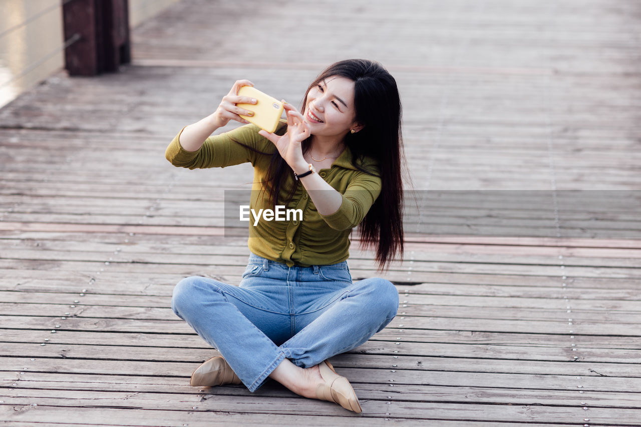 portrait of young woman using mobile phone