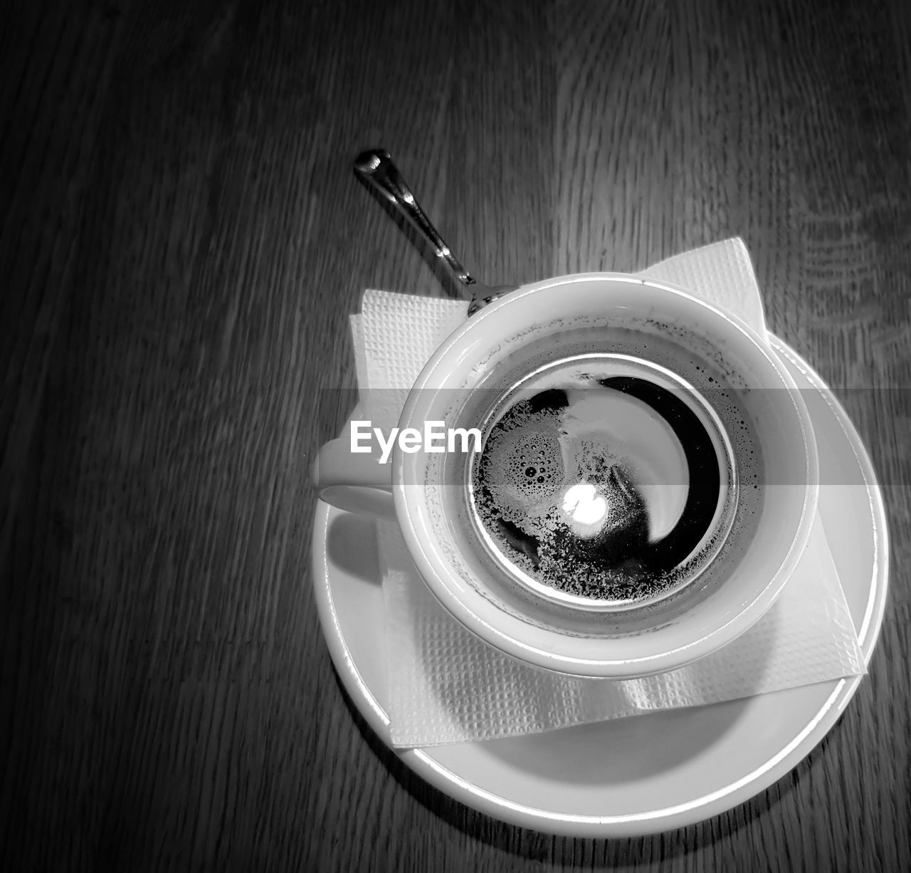 HIGH ANGLE VIEW OF COFFEE ON TABLE AT HOME