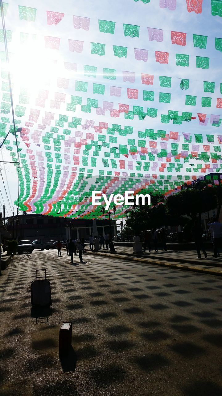 PEOPLE AT ILLUMINATED STREET