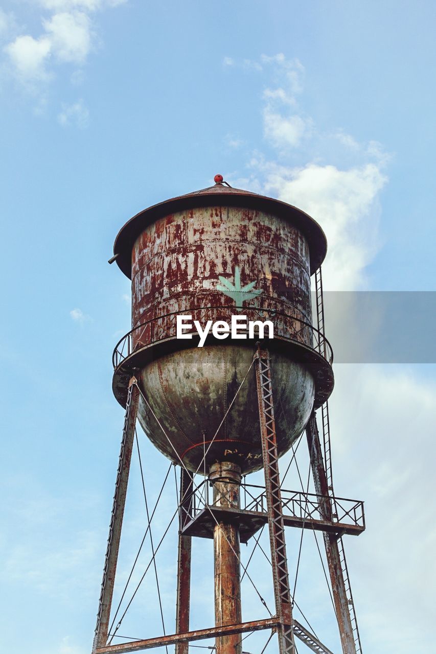 LOW ANGLE VIEW OF WATER TOWER WITH SKY