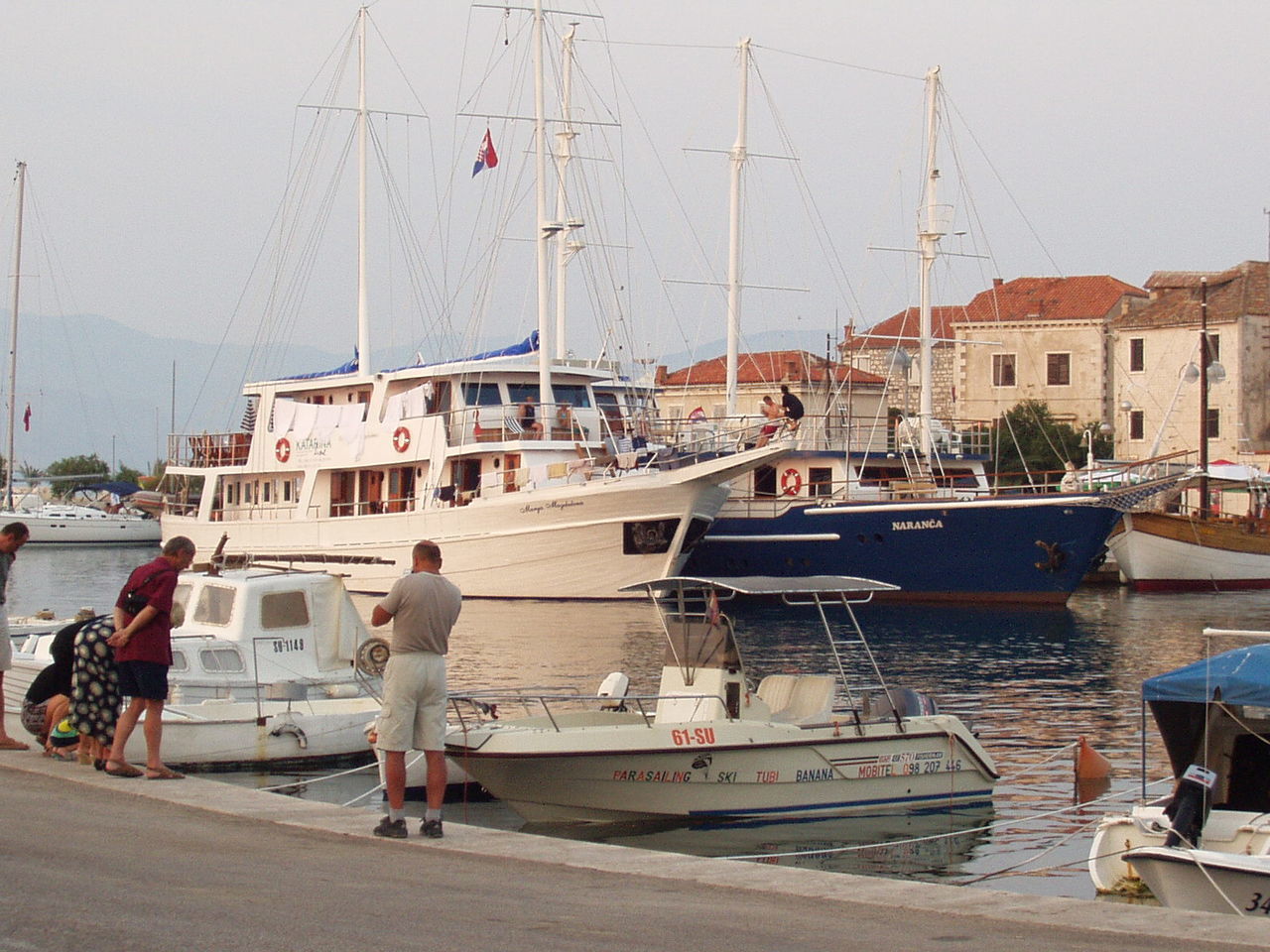 BOATS MOORED IN FRONT OF BUILDINGS