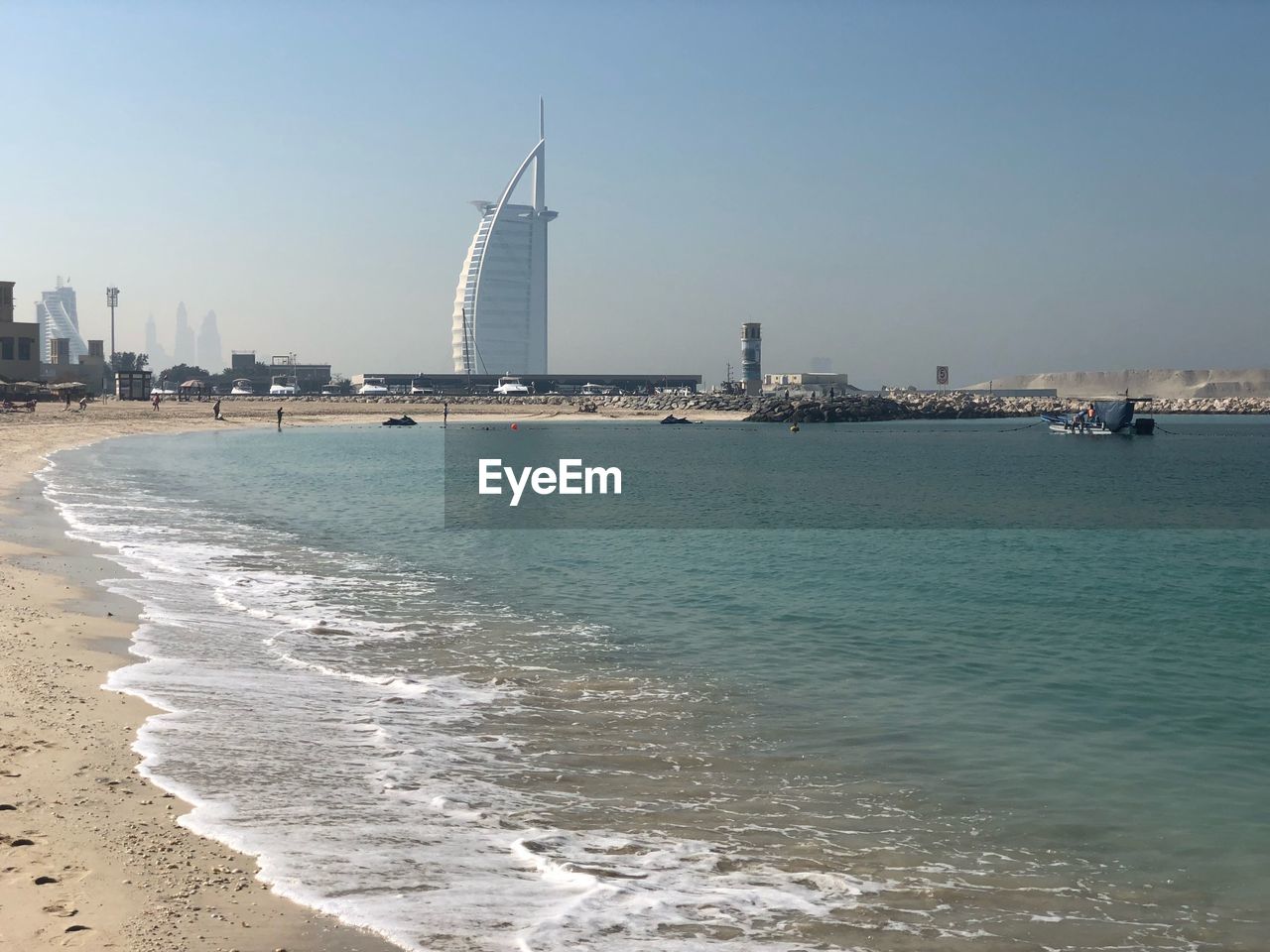 Scenic view of sea and buildings against sky