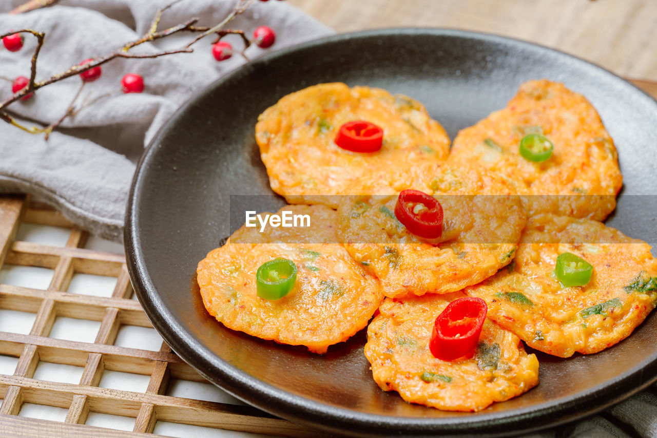 food and drink, food, dish, produce, fruit, no people, fried food, healthy eating, vegetable, freshness, fried, kitchen utensil, wood, baked, breakfast, cuisine, fast food, meal, spice, pan, snack, studio shot, indoors, frying pan, fritter, cooking pan, sweet food, tomato