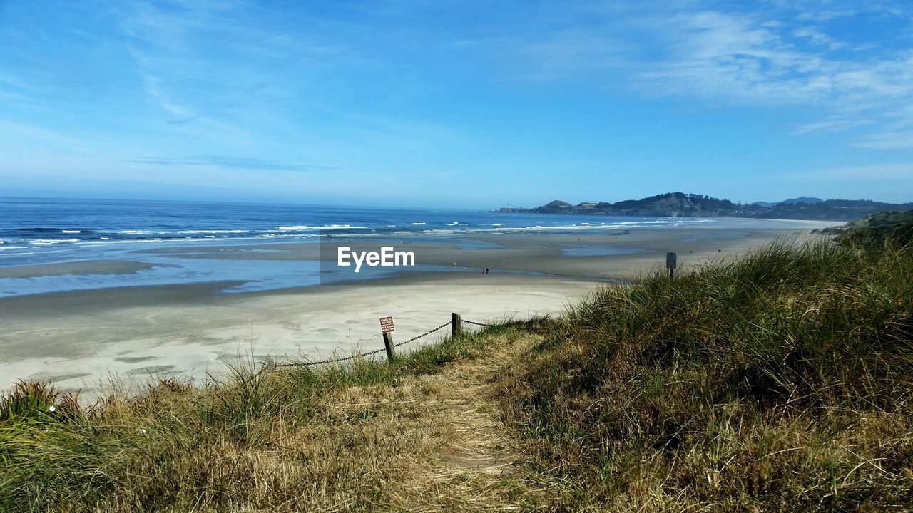 View of beach against blue sky