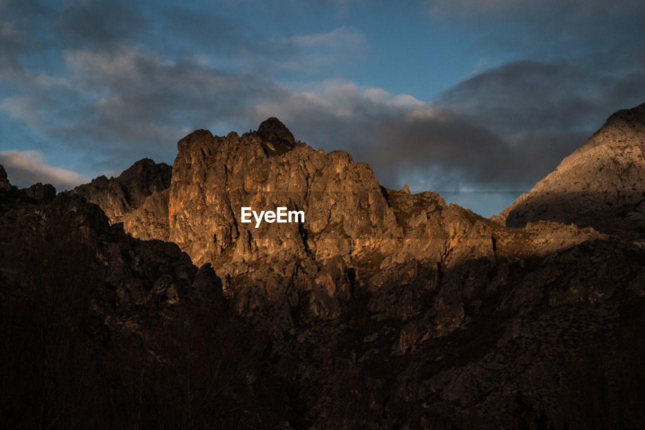 Scenic view of mountains against sky during sunset