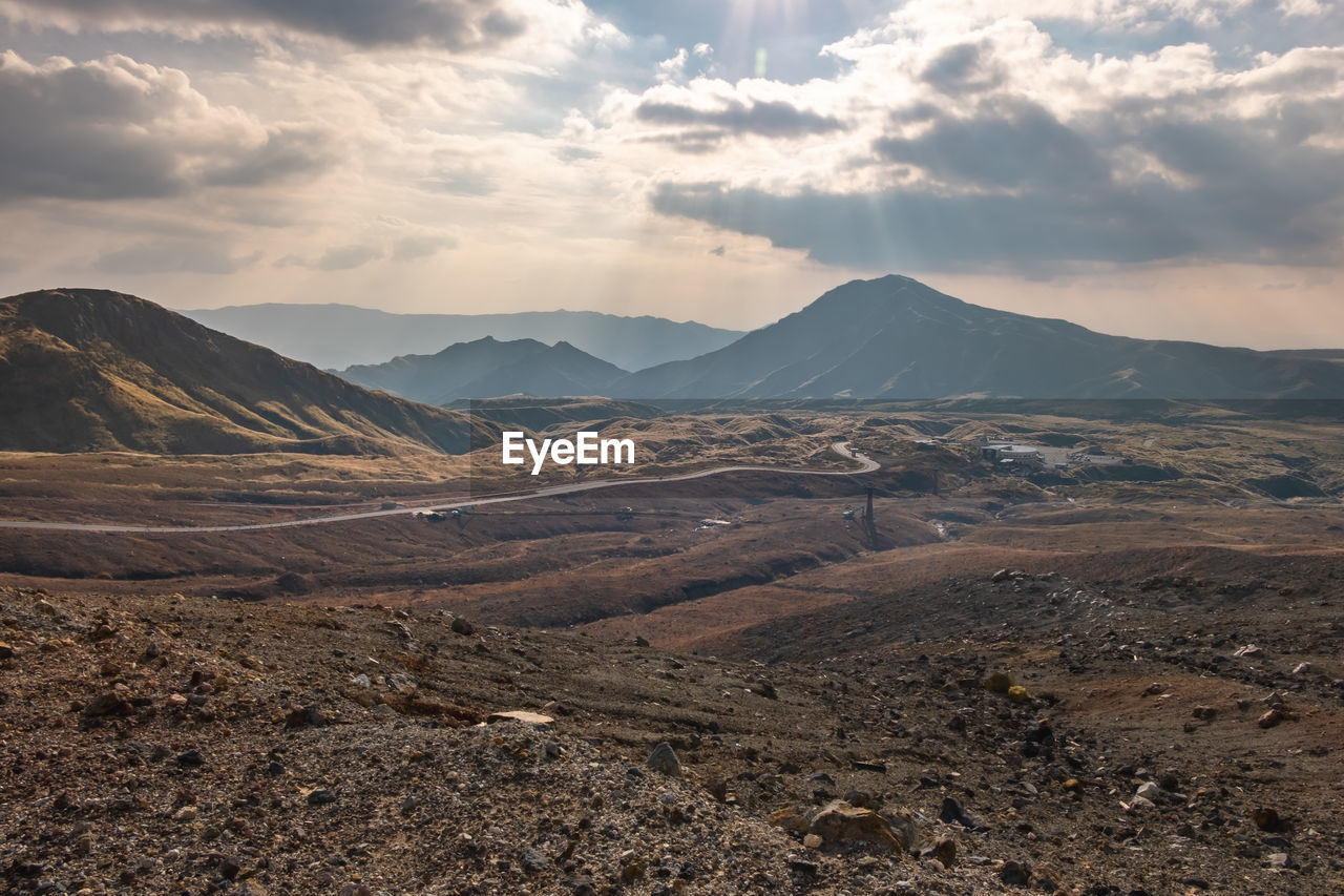 Scenic view of landscape and mountains against sky