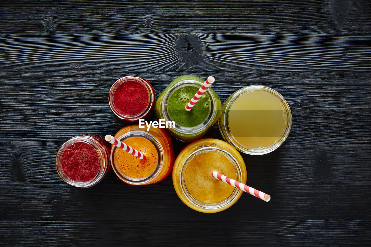 Directly above shot of smoothie in jars on table