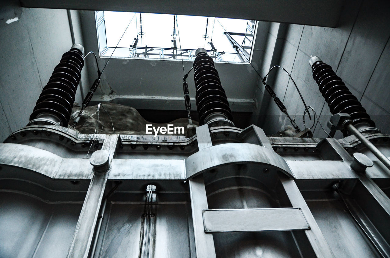 Low angle view of machinery in power station