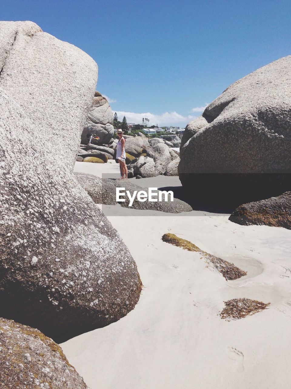 Woman at rocky beach