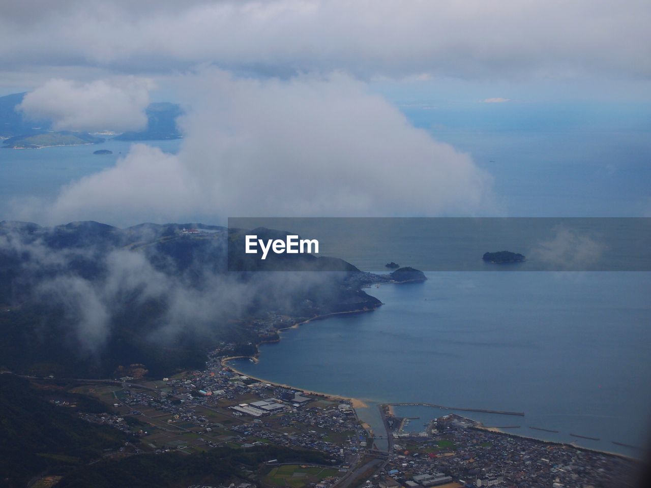 SEA AGAINST CLOUDY SKY