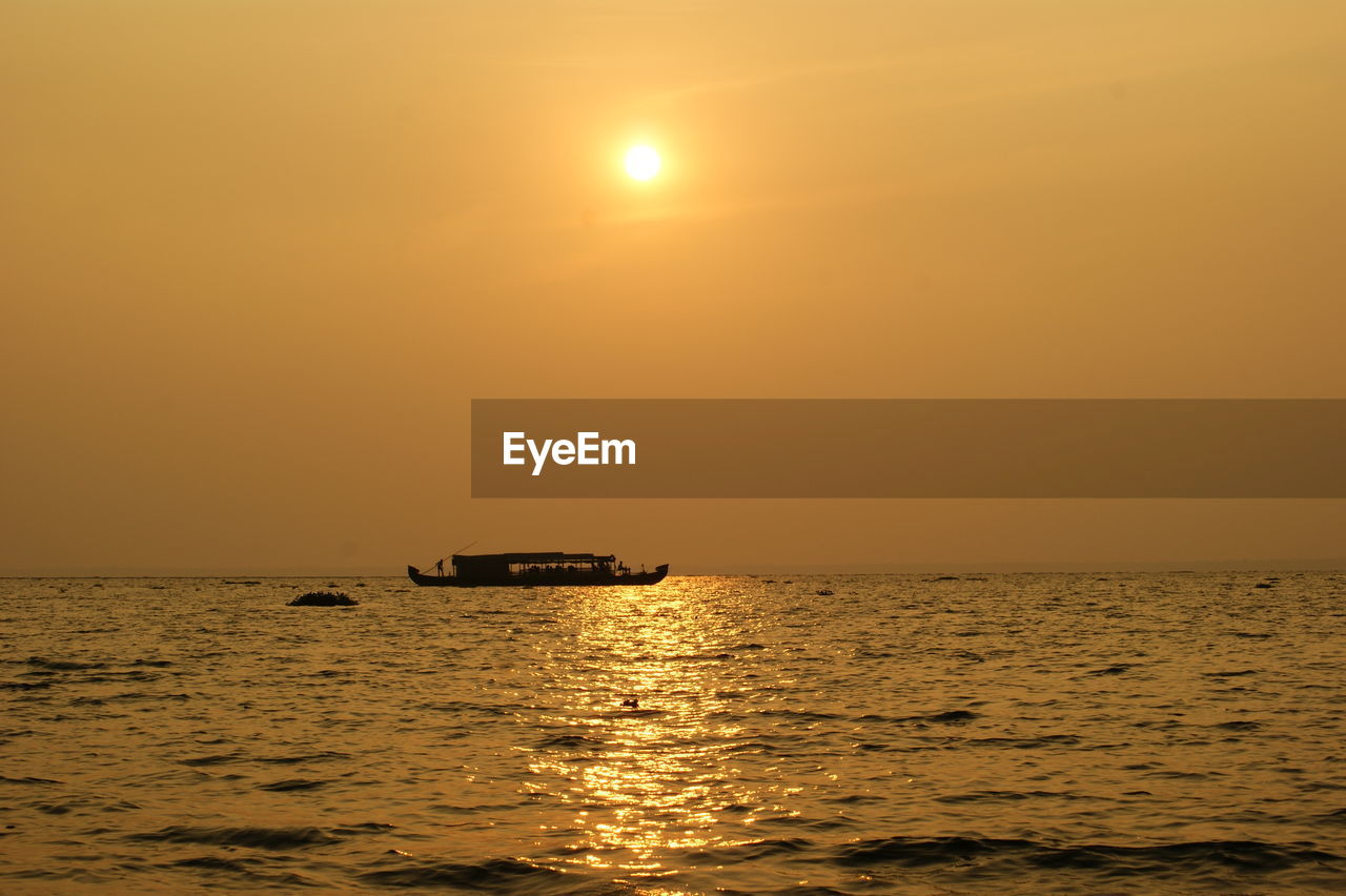 Scenic view of sunset over sea