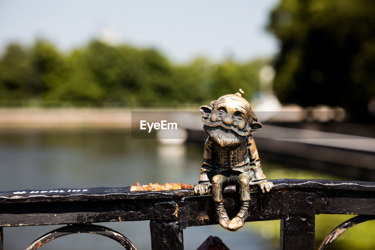 VIEW OF A DOG ON RAILING