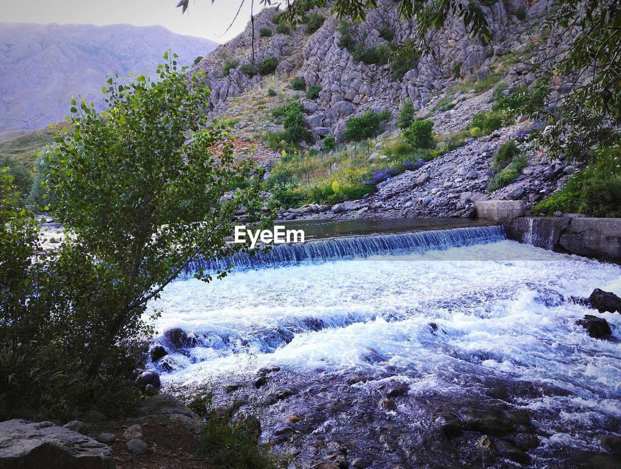 SCENIC VIEW OF WATERFALL