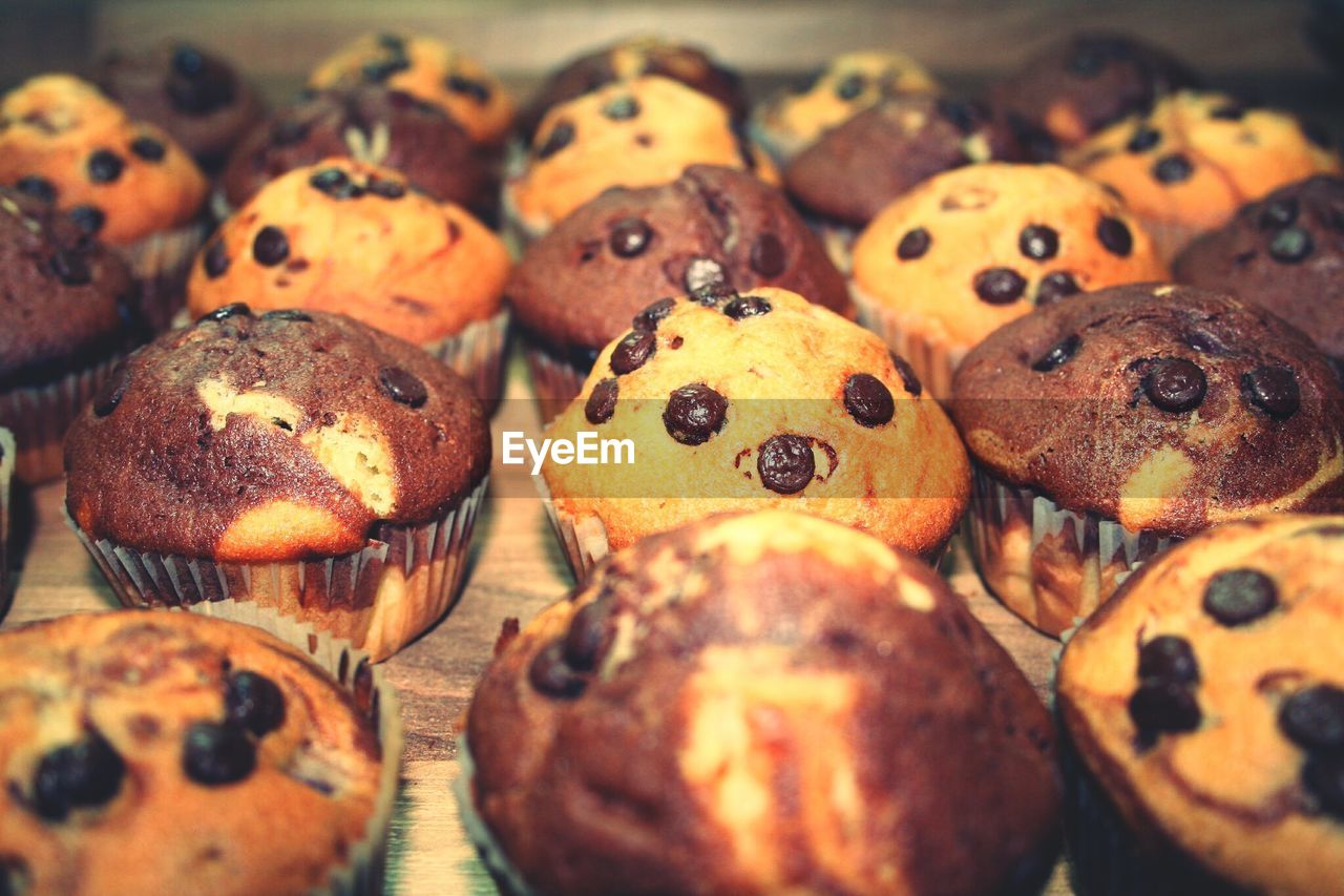 Close-up of chocolate chip muffins on table
