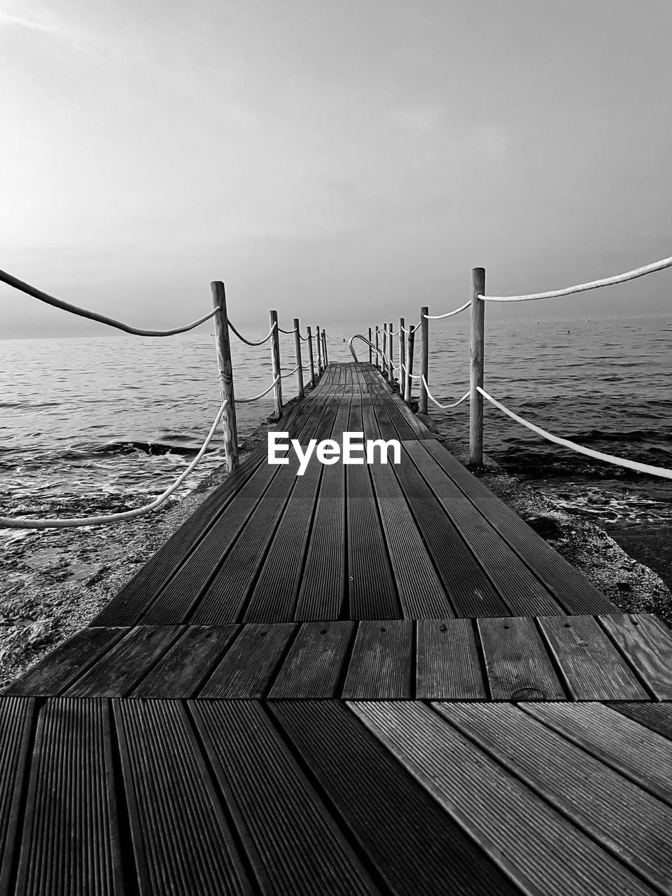 VIEW OF PIER ON SEA AGAINST SKY