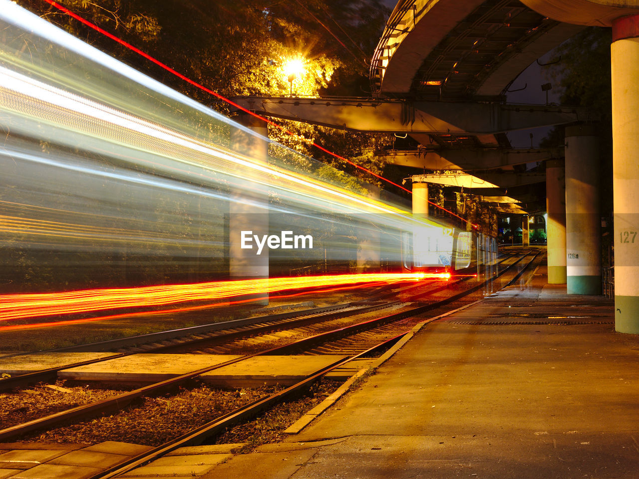 Blurred motion of train at railroad station during night