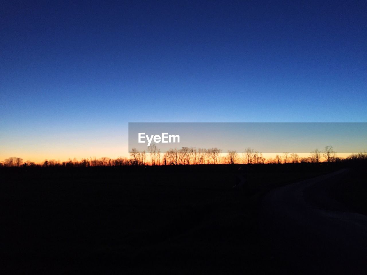 Scenic view of silhouette landscape during sunset