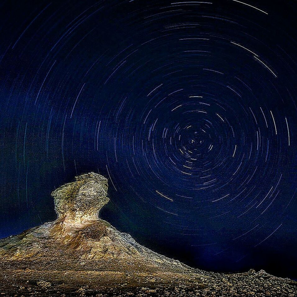 VIEW OF ILLUMINATED WATER AT NIGHT