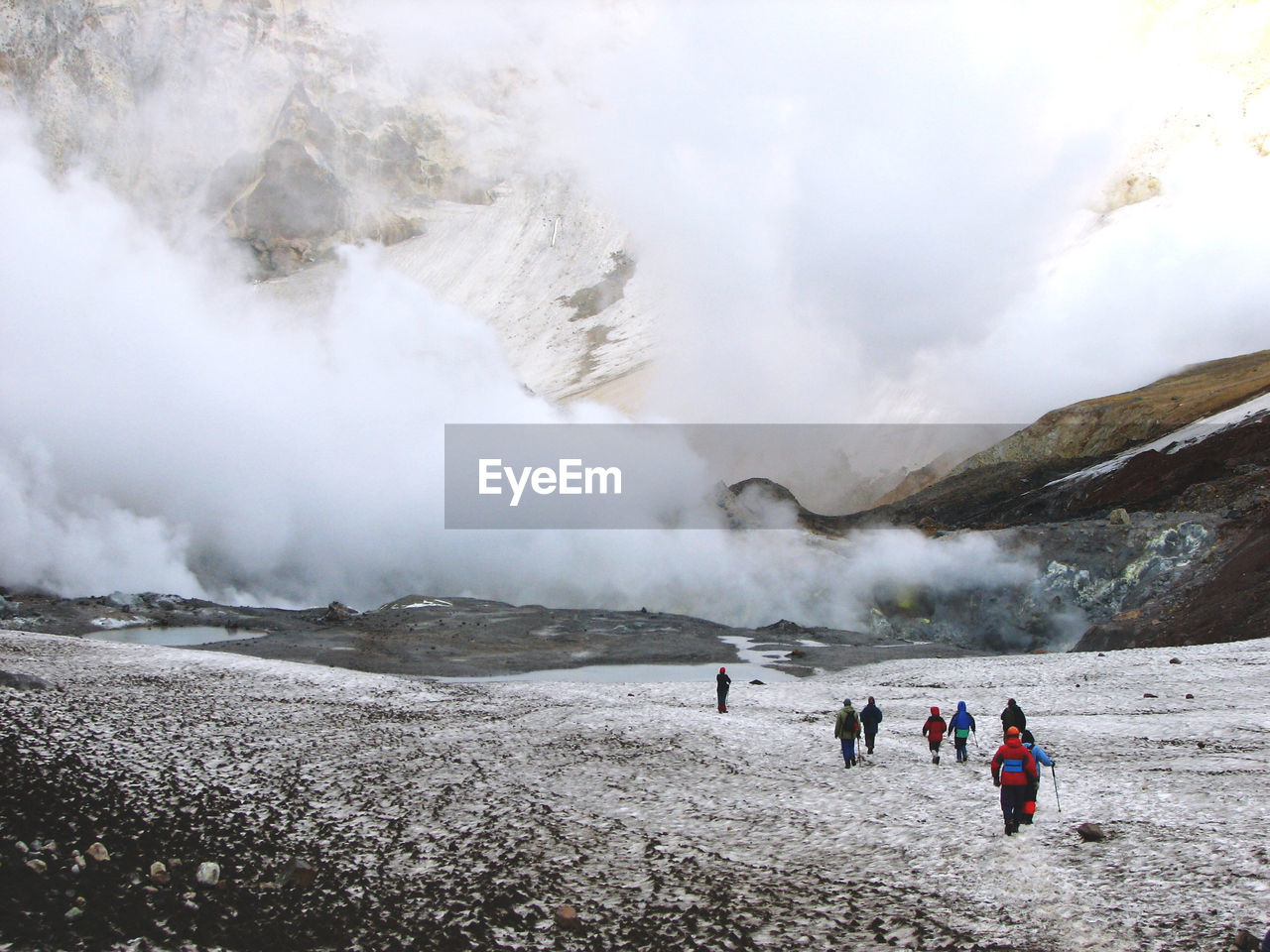 Group of people walking on mutnovsky volcano