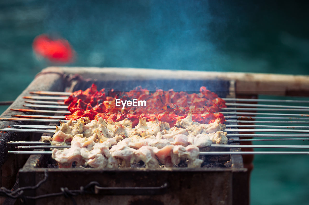 Close-up of meat on barbecue grill