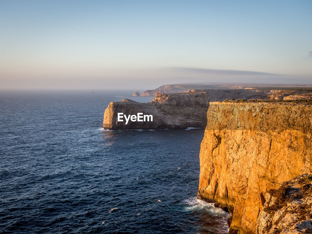 SCENIC VIEW OF SEA AGAINST SKY AT SUNSET