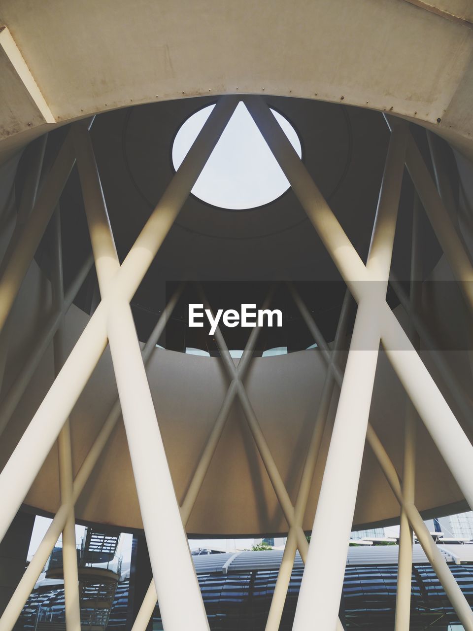 LOW ANGLE VIEW OF BRIDGE IN ILLUMINATED BUILDING