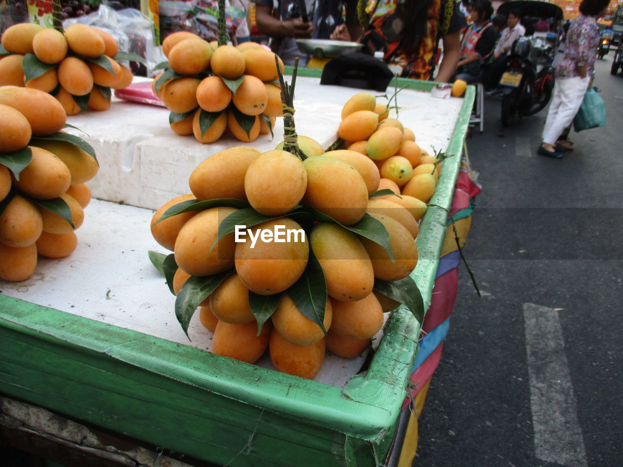 HIGH ANGLE VIEW OF VARIOUS FRUITS FOR SALE AT MARKET STALL