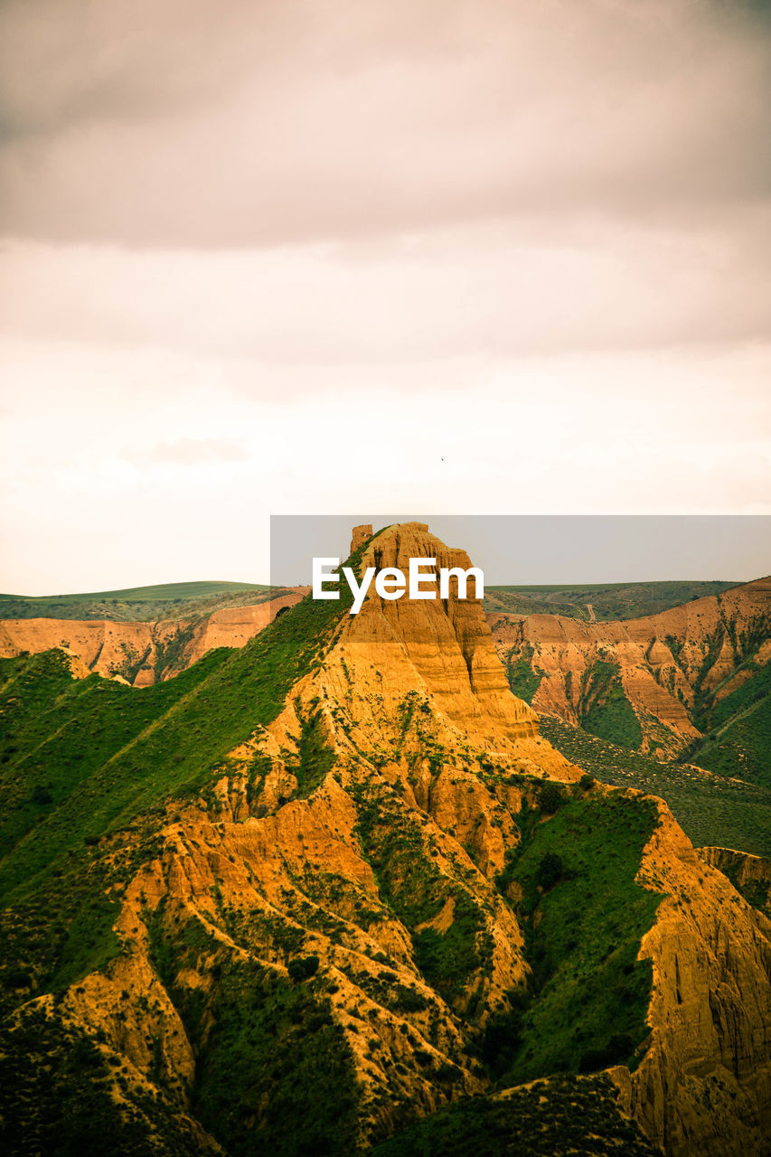 Scenic view of rocky mountains against sky