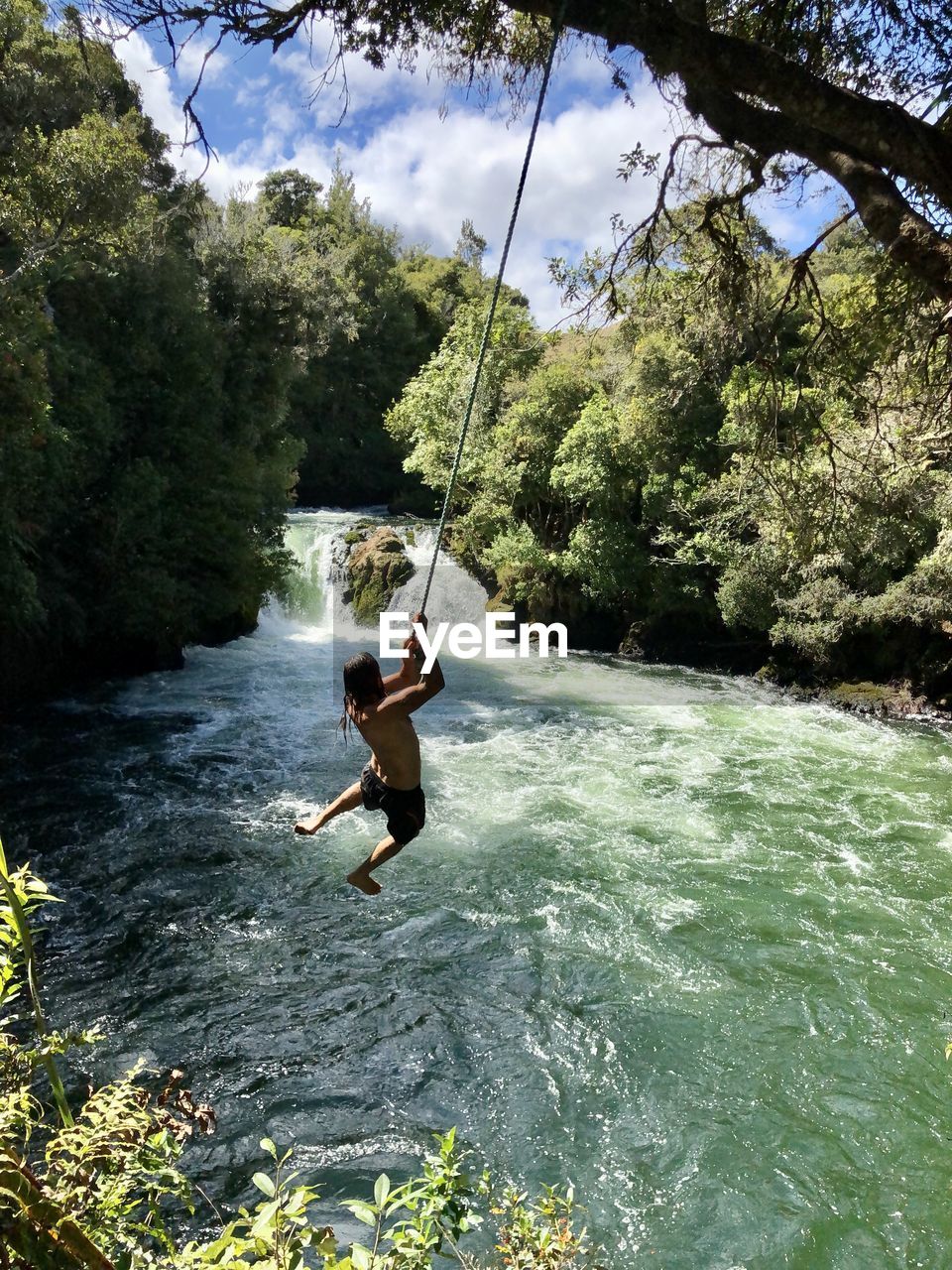 MAN IN BOAT ON RIVER