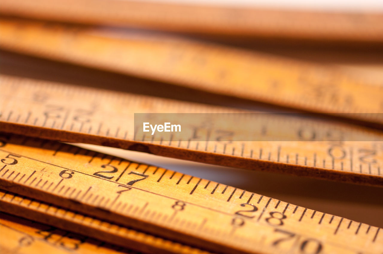 Close-up of wooden rulers on table