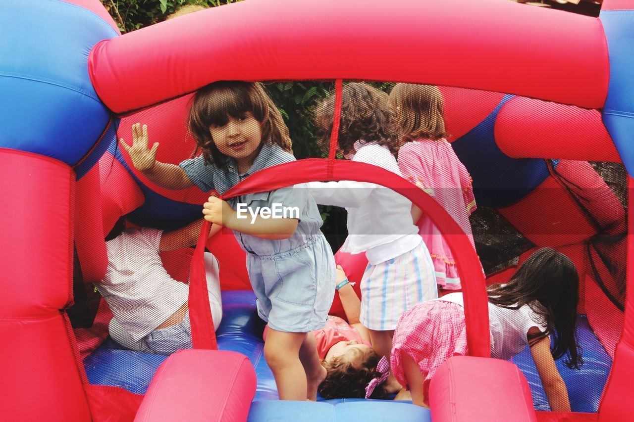 Girls enjoying in bouncy castle