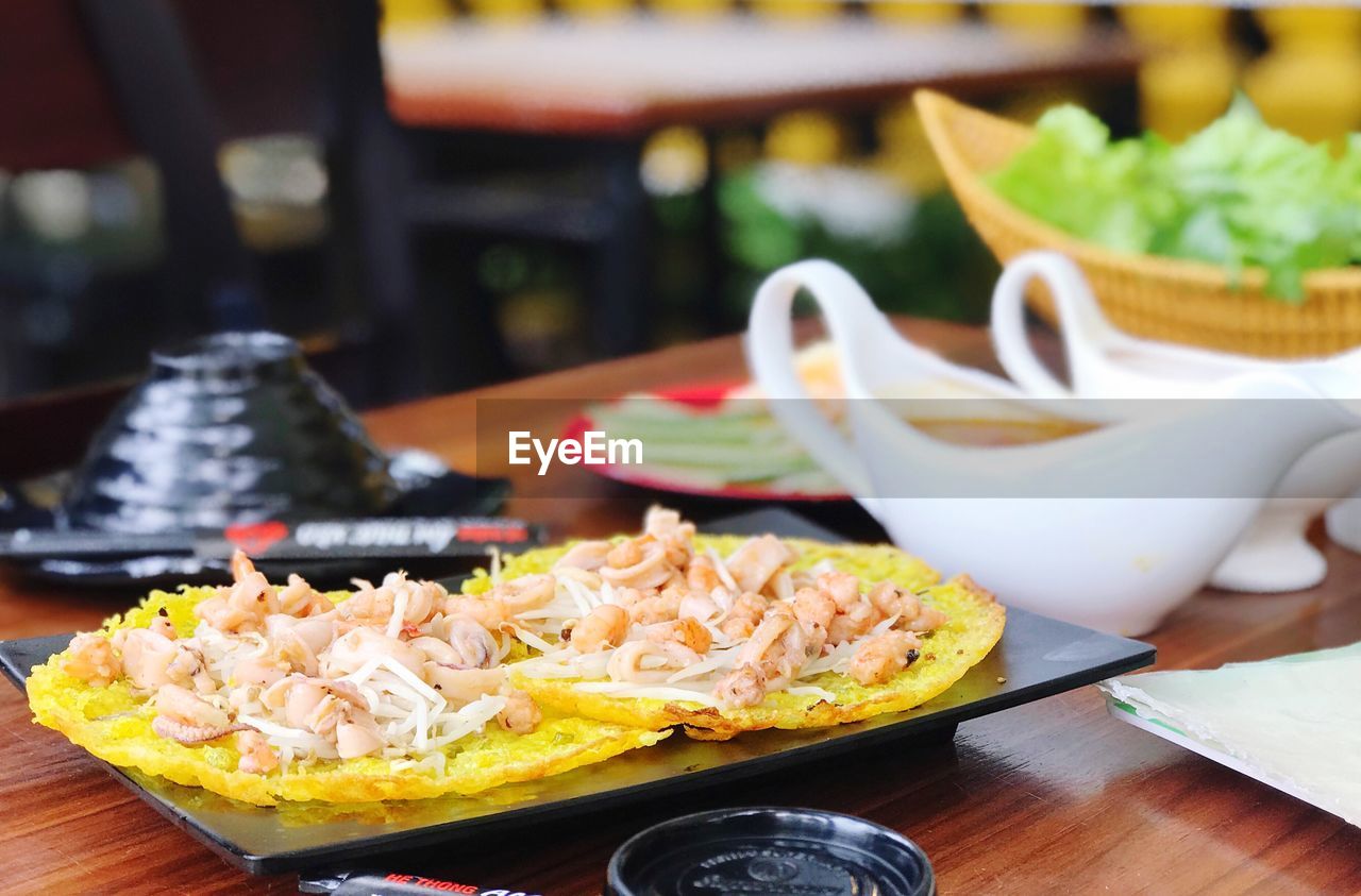 CLOSE-UP OF FOOD SERVED ON TABLE