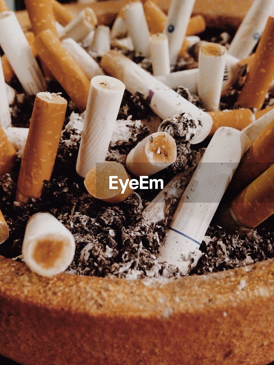 Close-up of cigarettes in ashtray