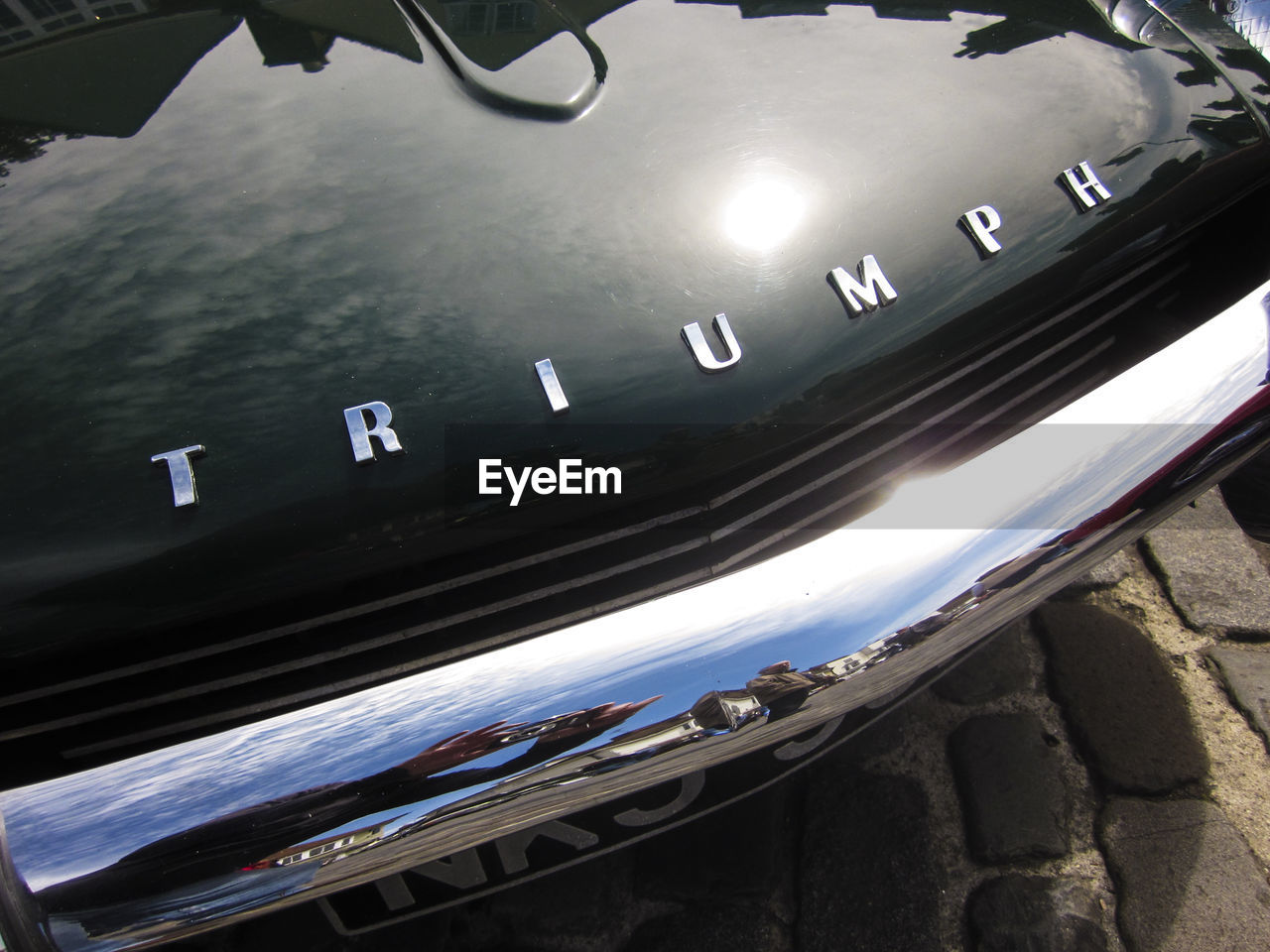 HIGH ANGLE VIEW OF CARS ON SIDE-VIEW MIRROR