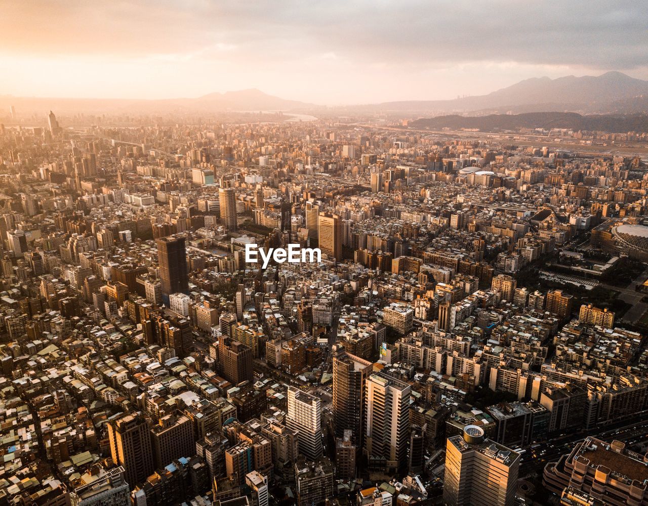 High angle view of modern buildings in city against sky