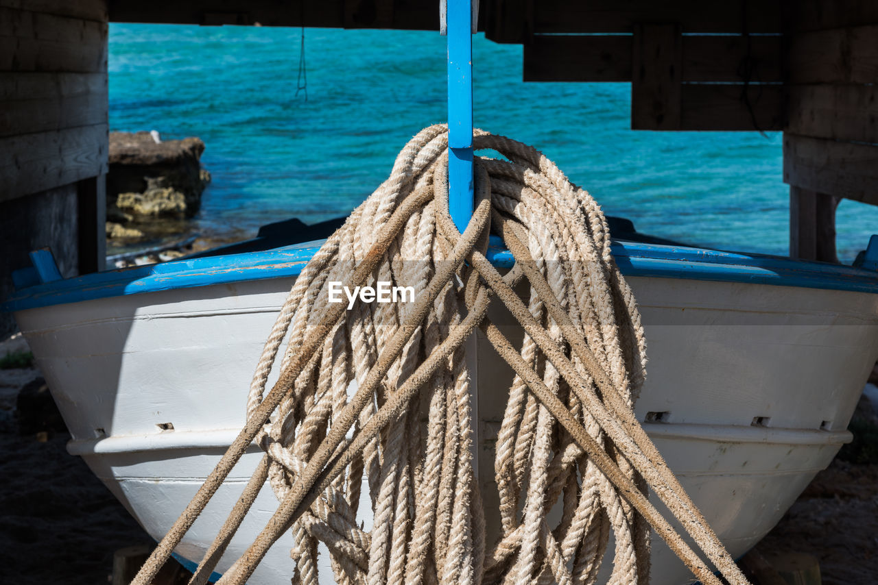 Close-up of boat moored at harbor