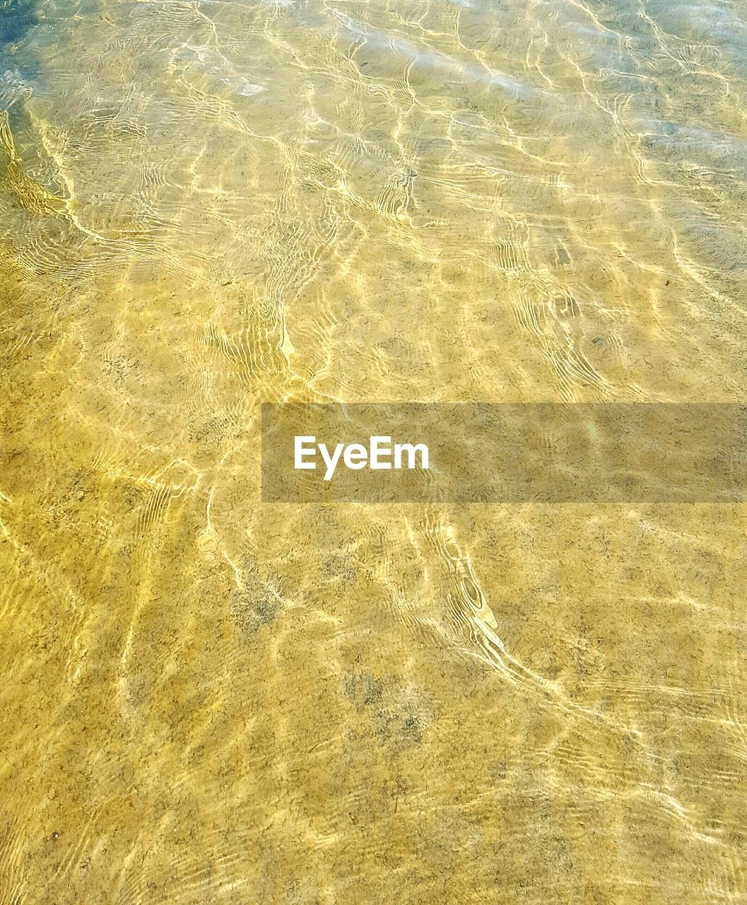 CLOSE-UP OF RIPPLED WATER