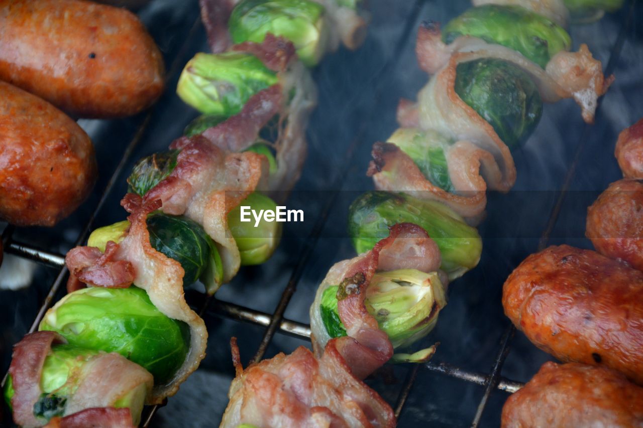 High angle view of meat and vegetables on barbecue grill