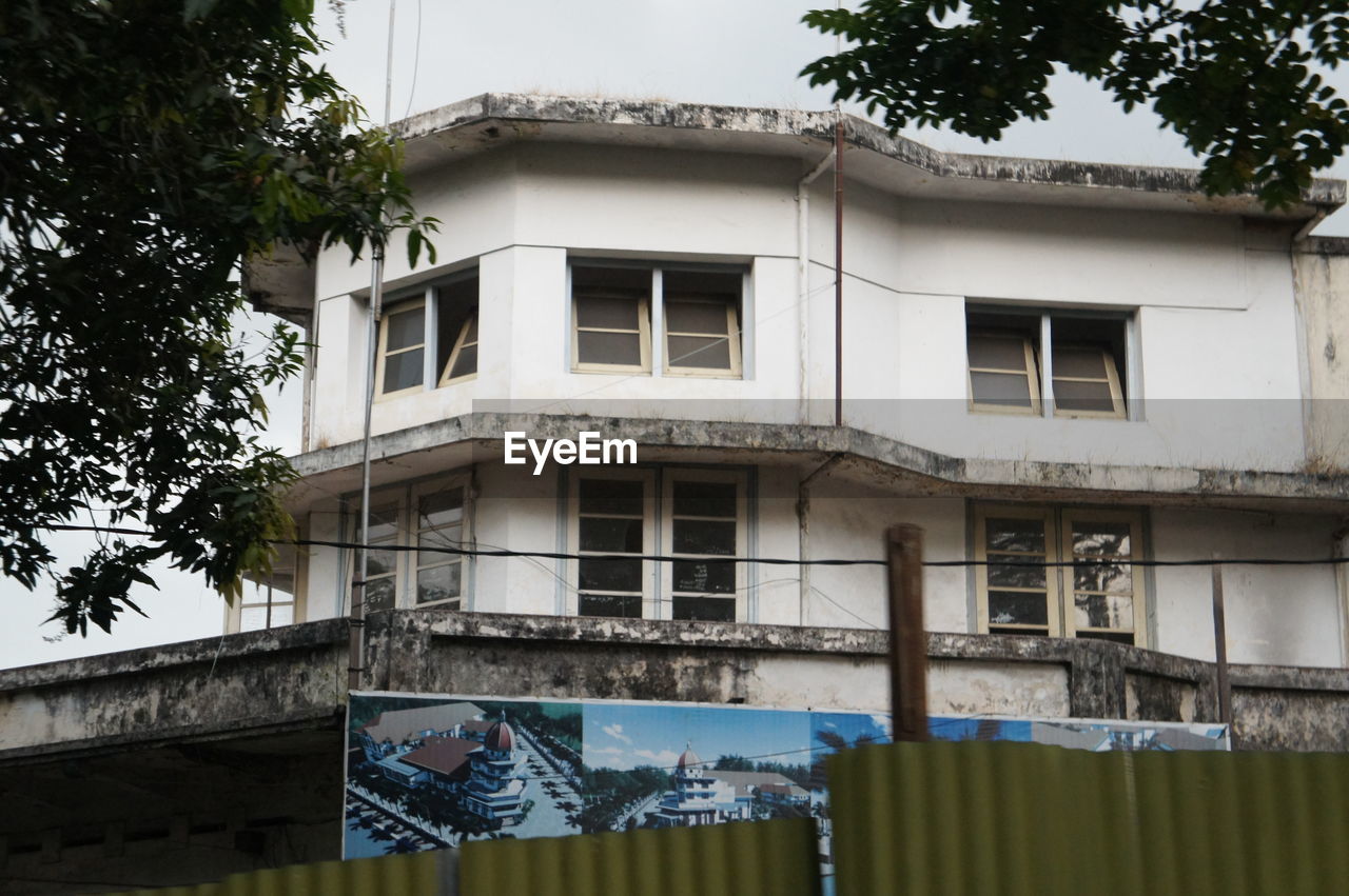 LOW ANGLE VIEW OF RESIDENTIAL BUILDING