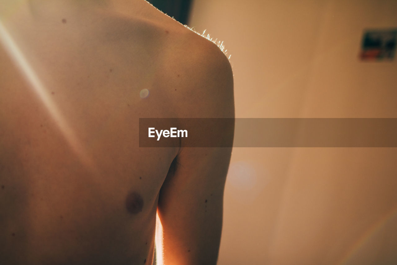 Pretty bare male in chest soft golden evening light