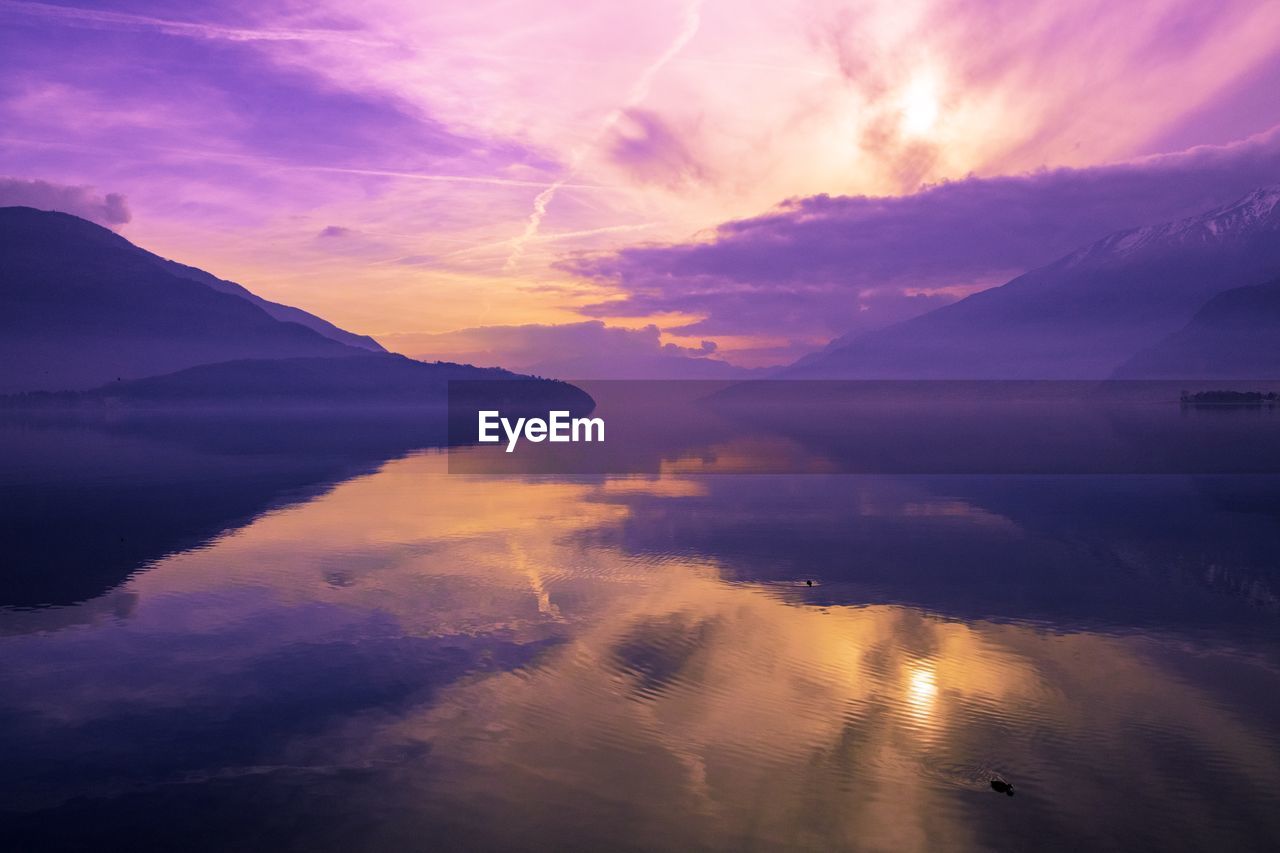 Scenic view of lake against sky during sunset