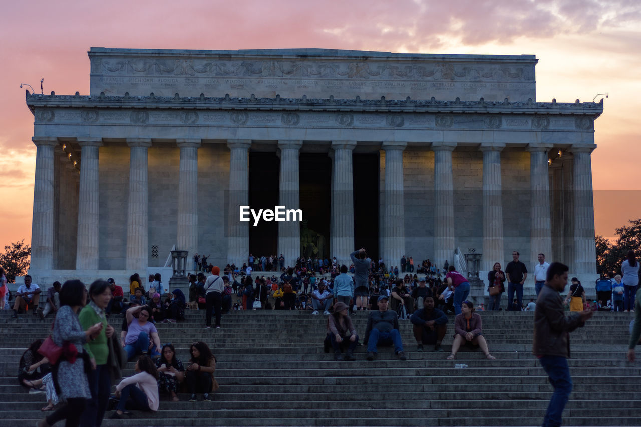 GROUP OF PEOPLE ON HISTORICAL BUILDING