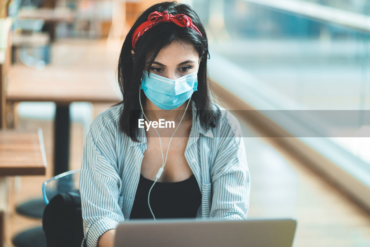 Young woman using laptop